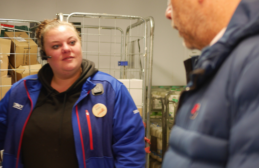 shift manager Emily shows Mark how surplus food is sorted